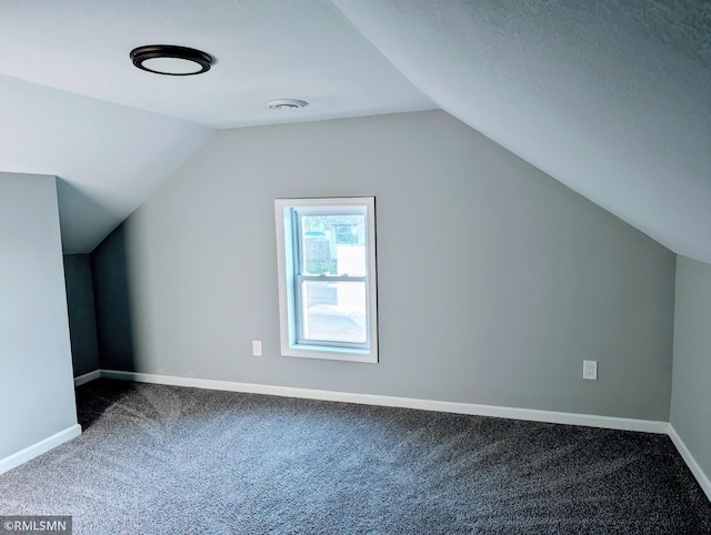 bonus room with carpet flooring, vaulted ceiling, and baseboards