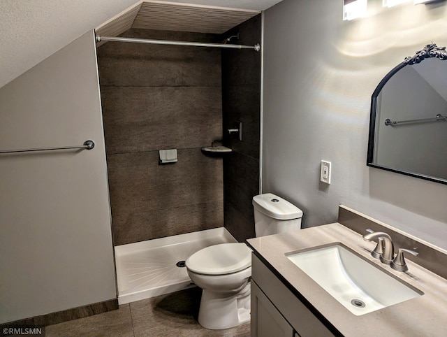 bathroom with toilet, a shower stall, tile patterned flooring, and vanity