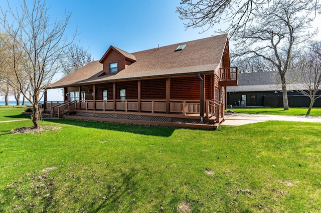 37009 Blarney Beach Rd, Everts Twp, MN 56515 - back of property featuring a yard, covered porch, and roof with shingles