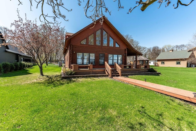 37009 Blarney Beach Rd, Everts Twp, MN 56515 - rear view of house featuring a yard and a deck