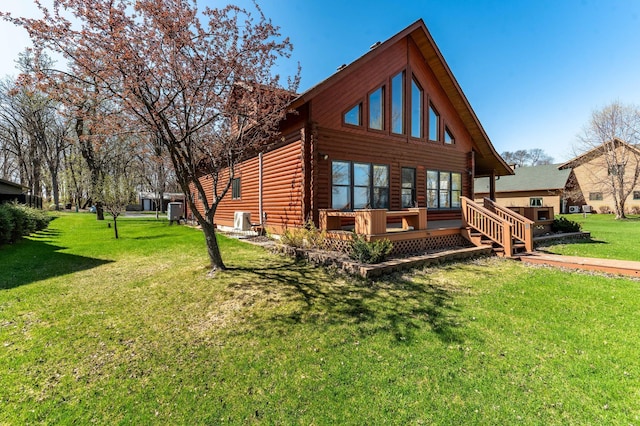 37009 Blarney Beach Rd, Everts Twp, MN 56515 - rear view of house with a yard, log siding, and central AC