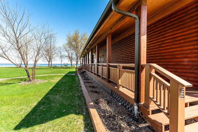 37009 Blarney Beach Rd, Everts Twp, MN 56515 - view of property exterior featuring a water view and a lawn