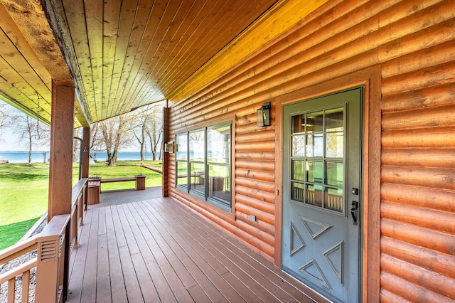 37009 Blarney Beach Rd, Everts Twp, MN 56515 - wooden terrace with a water view, a porch, and a lawn