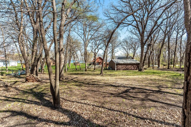 37009 Blarney Beach Rd, Everts Twp, MN 56515 - view of yard featuring an outbuilding and a shed