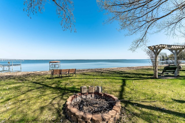 37009 Blarney Beach Rd, Everts Twp, MN 56515 - view of green lawn featuring an outdoor fire pit and a water view