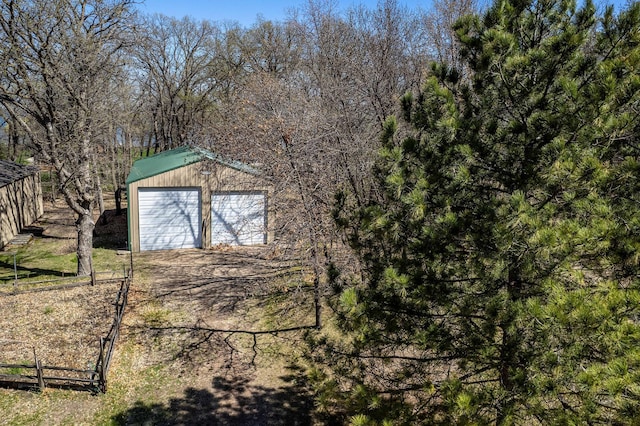 37009 Blarney Beach Rd, Everts Twp, MN 56515 - view of outdoor structure featuring an outdoor structure, fence, and driveway