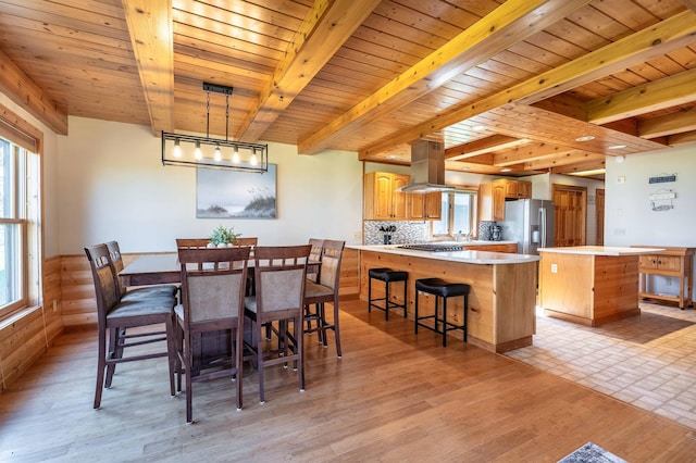 37009 Blarney Beach Rd, Everts Twp, MN 56515 - dining room with wood ceiling, beamed ceiling, and light wood finished floors