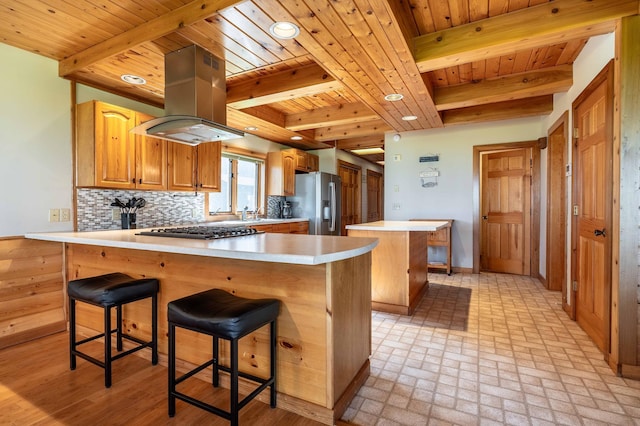 37009 Blarney Beach Rd, Everts Twp, MN 56515 - kitchen with island range hood, wood ceiling, stainless steel appliances, a peninsula, and beam ceiling