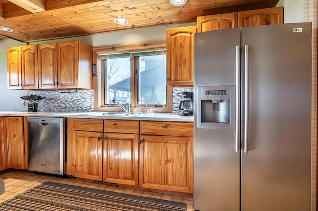 37009 Blarney Beach Rd, Everts Twp, MN 56515 - kitchen featuring stainless steel appliances, light countertops, wooden ceiling, a sink, and backsplash
