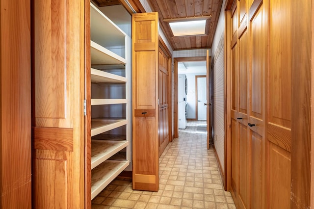 37009 Blarney Beach Rd, Everts Twp, MN 56515 - hallway with light floors and washer / dryer