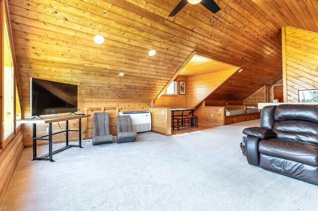 37009 Blarney Beach Rd, Everts Twp, MN 56515 - unfurnished living room featuring wooden walls, carpet floors, vaulted ceiling, ceiling fan, and wooden ceiling