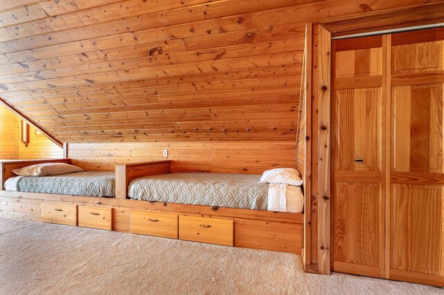 37009 Blarney Beach Rd, Everts Twp, MN 56515 - unfurnished bedroom with light colored carpet, wooden ceiling, and wood walls
