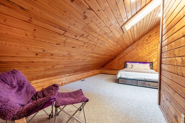 37009 Blarney Beach Rd, Everts Twp, MN 56515 - bedroom with carpet, wooden ceiling, wooden walls, a skylight, and lofted ceiling
