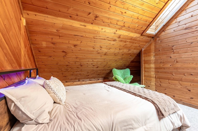 37009 Blarney Beach Rd, Everts Twp, MN 56515 - bedroom with carpet floors, lofted ceiling, wooden walls, a skylight, and wood ceiling