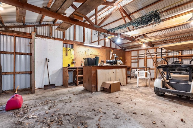 37009 Blarney Beach Rd, Everts Twp, MN 56515 - garage with a workshop area and metal wall
