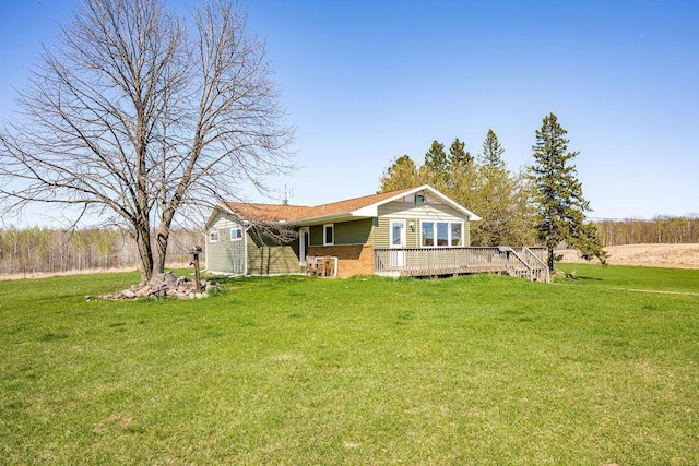 29618 110th Pl, Sturgeon Lake, MN 55783 - view of front of home with a deck, a front lawn, and brick siding