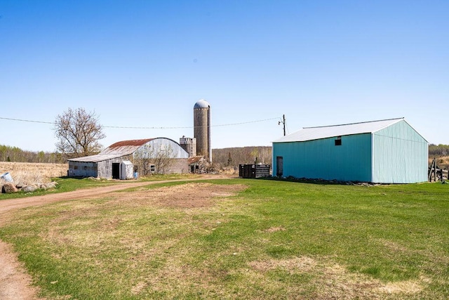 29618 110th Pl, Sturgeon Lake, MN 55783 - view of green lawn with an outdoor structure, a pole building, and cooling unit