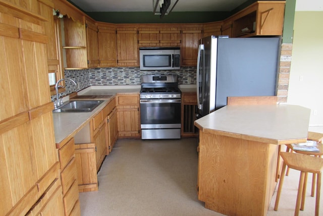 29618 110th Pl, Sturgeon Lake, MN 55783 - kitchen featuring stainless steel appliances, a sink, open shelves, a peninsula, and backsplash