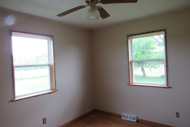 29618 110th Pl, Sturgeon Lake, MN 55783 - unfurnished room featuring wood finished floors, a ceiling fan, and baseboards