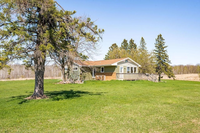 29618 110th Pl, Sturgeon Lake, MN 55783 - view of green lawn featuring a wooden deck