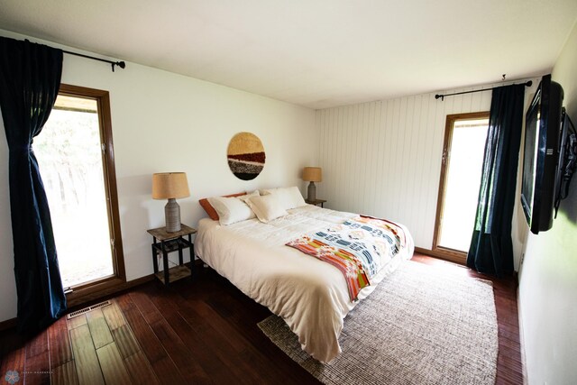 130 Woodcrest Dr N, Fargo, ND 58102 - bedroom with hardwood / wood-style floors and multiple windows