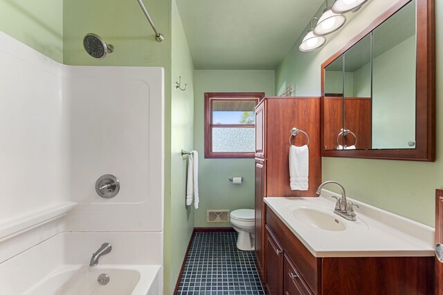 full bathroom with baseboards, vanity, toilet, tub / shower combination, and tile patterned floors