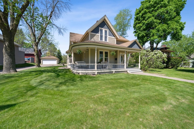 1112 4th St S, Stillwater, MN 55082 - view of front of home with a porch, a front yard, a detached garage, an outbuilding, and a shingled roof