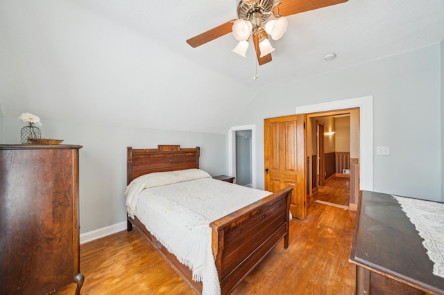 1112 4th St S, Stillwater, MN 55082 - bedroom with wood finished floors, lofted ceiling, ceiling fan, and baseboards