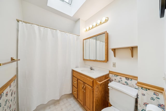 1112 4th St S, Stillwater, MN 55082 - full bathroom with a skylight, toilet, vanity, and tile patterned floors