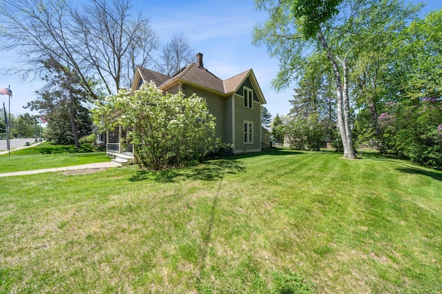 1112 4th St S, Stillwater, MN 55082 - view of side of property featuring a lawn and a chimney