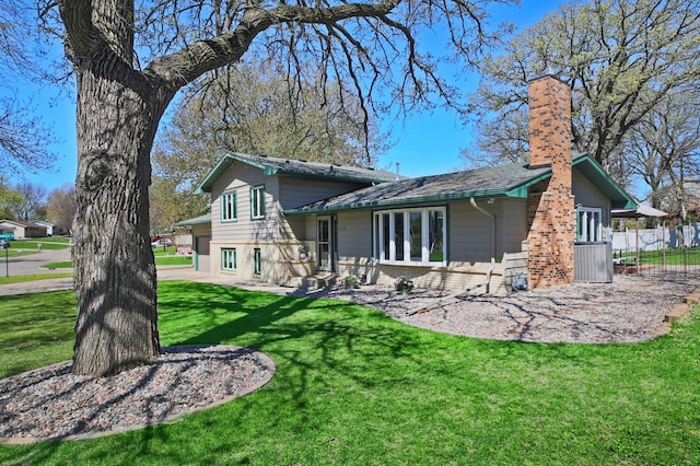 rear view of house with a chimney