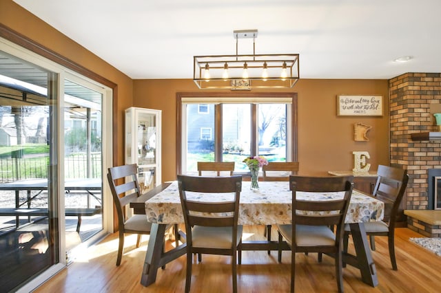 dining space with wood finished floors