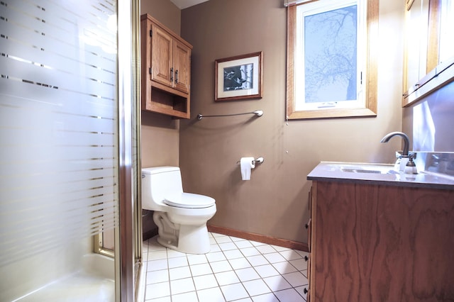 full bathroom with tile patterned floors, vanity, a shower stall, toilet, and baseboards