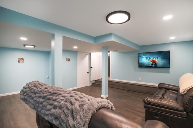 living area with wood finished floors, baseboards, and recessed lighting