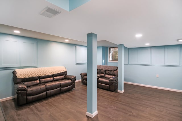 living room with dark wood-style flooring, recessed lighting, and baseboards