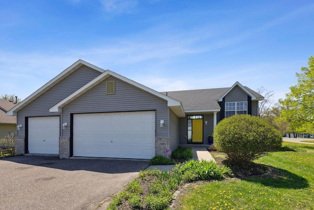 view of front of house featuring a garage and driveway