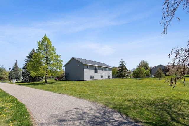 view of side of property with a lawn