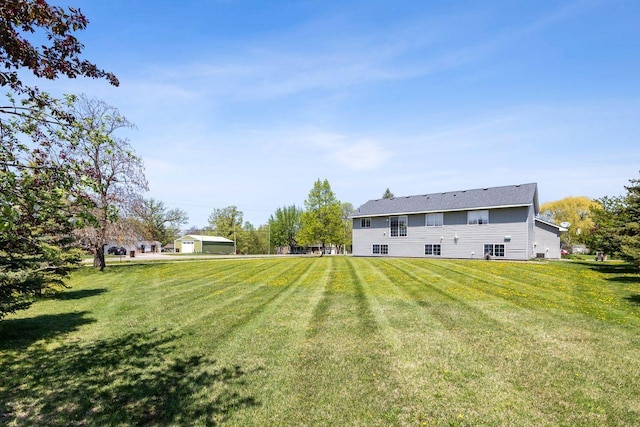 rear view of property featuring a yard