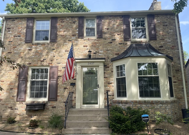 view of front of property with a chimney