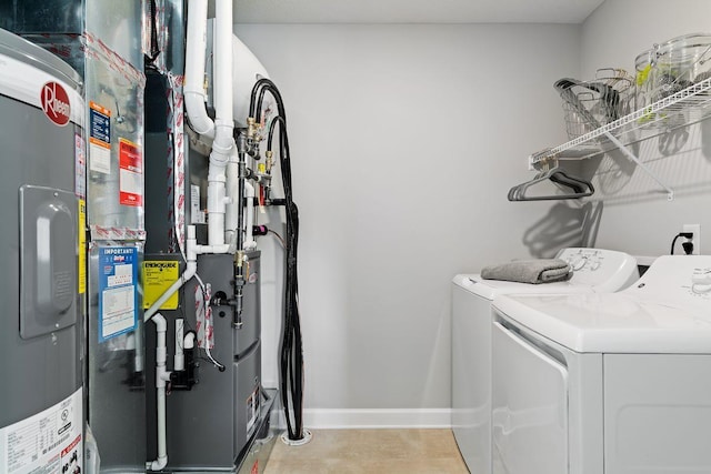 14420 Allerton Way, Rosemount, MN 55068 - laundry area with washer and clothes dryer, heating unit, electric water heater, and baseboards