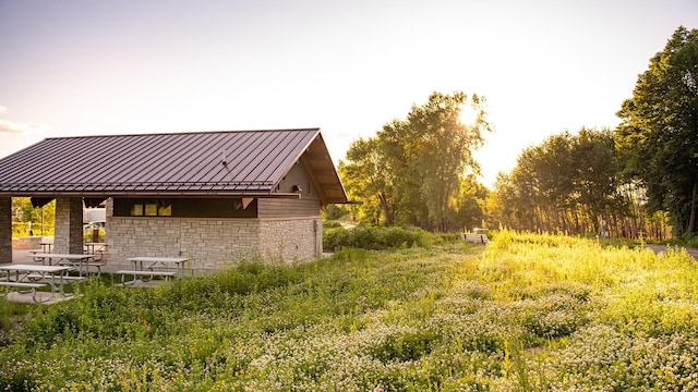 14420 Allerton Way, Rosemount, MN 55068 - view of home's exterior with a standing seam roof, stone siding, and metal roof