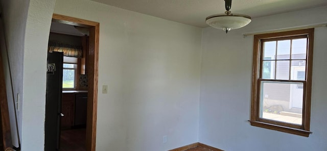 unfurnished room with healthy amount of natural light