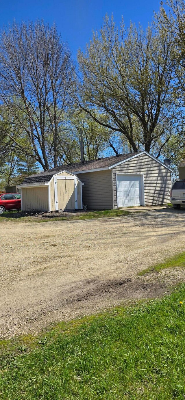 view of shed featuring driveway