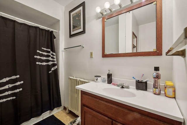 full bathroom with a shower with curtain, radiator, and vanity