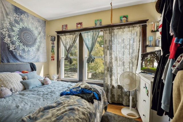 bedroom with wood finished floors