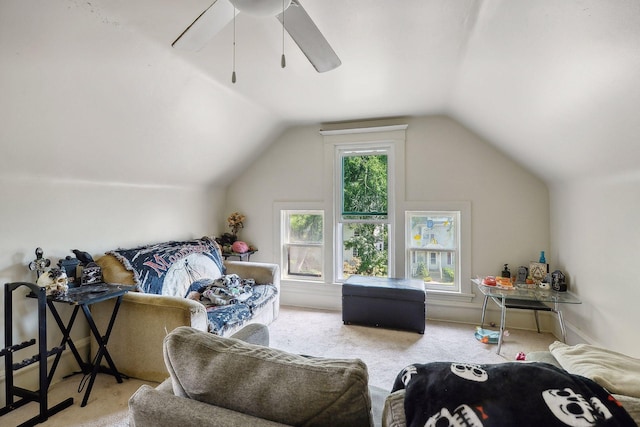 interior space featuring ceiling fan, carpet, and vaulted ceiling