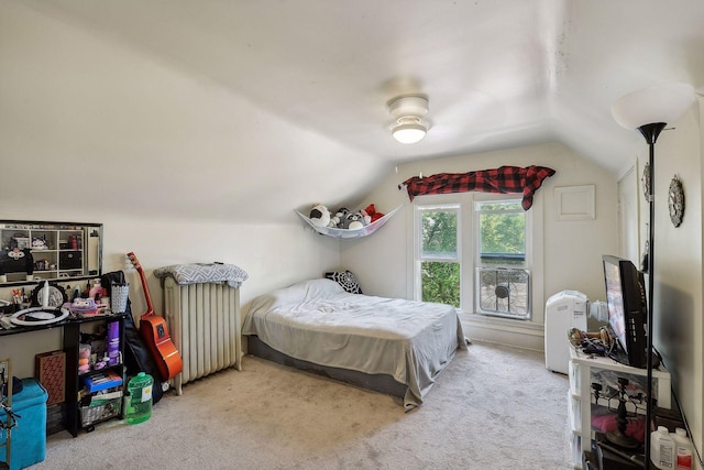 carpeted bedroom featuring vaulted ceiling