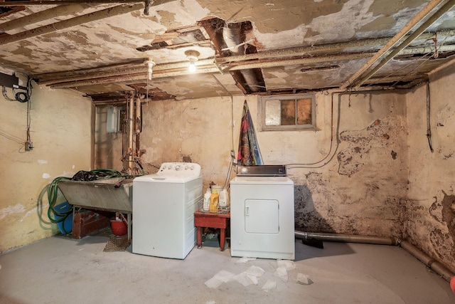 unfinished below grade area featuring washer and dryer