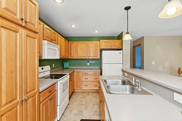 kitchen with white appliances, a sink, pendant lighting, light countertops, and recessed lighting