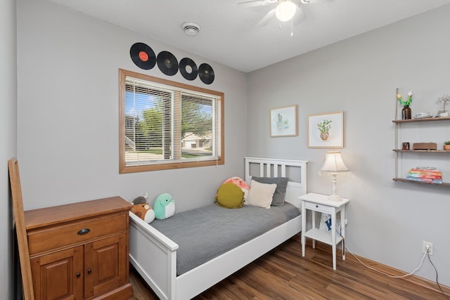 bedroom with dark wood finished floors and a ceiling fan